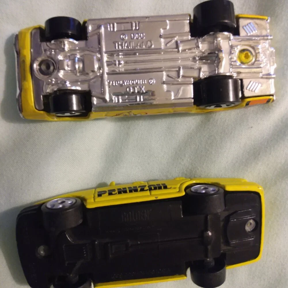 2002 Golden Wheel and 2004 Hot Wheels car